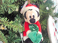 Foto de Micjey com roupa de Papai Noel