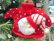 Foto de blusinha vermelha com enfeite de Papai Noel